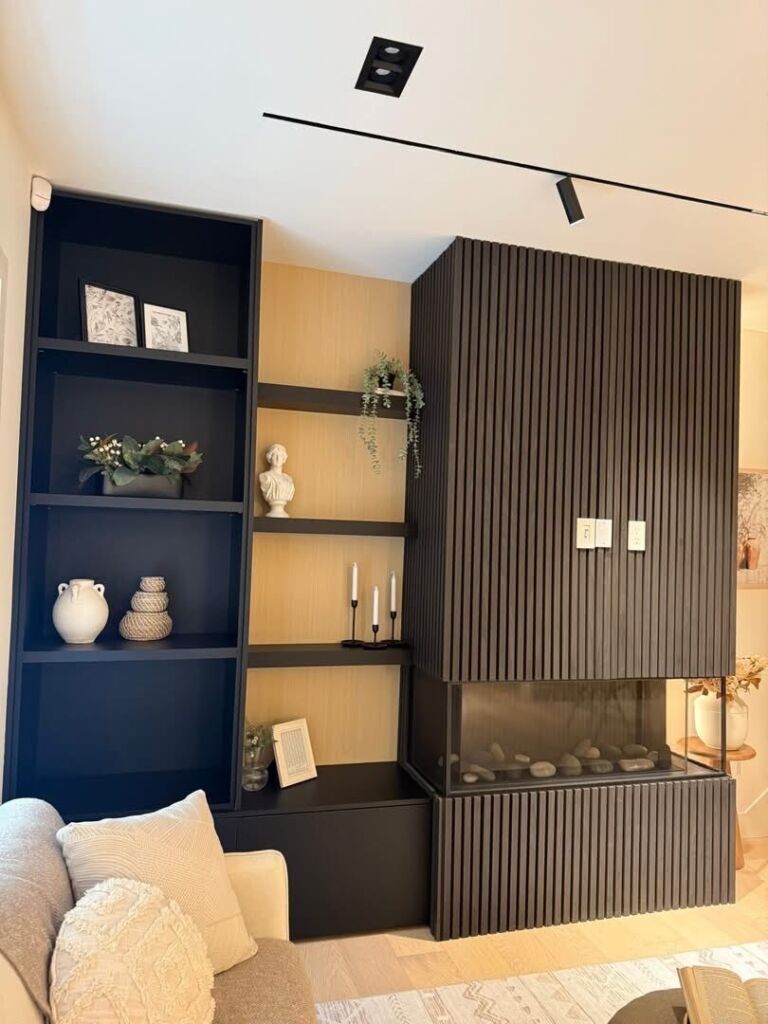 Fluted fireplace surround with black display shelving