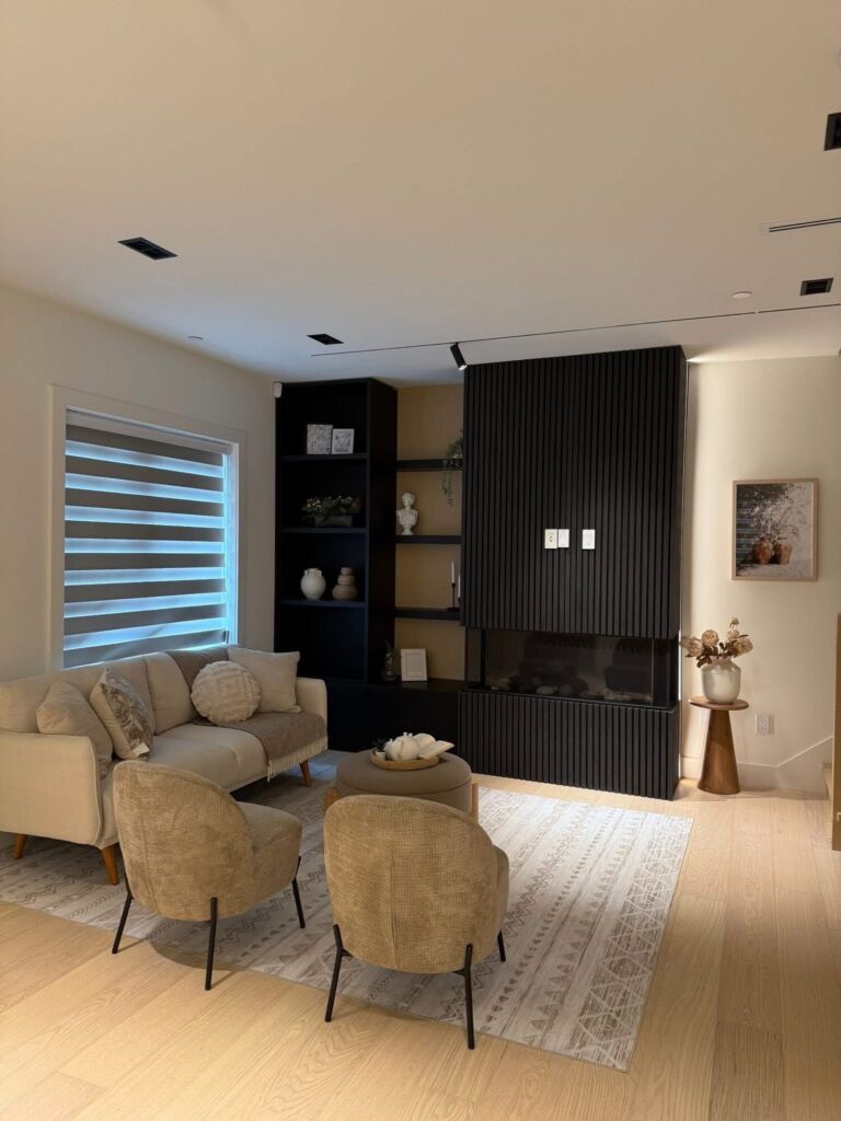 Living room renovation with fluted fireplace feature wall and track lighting